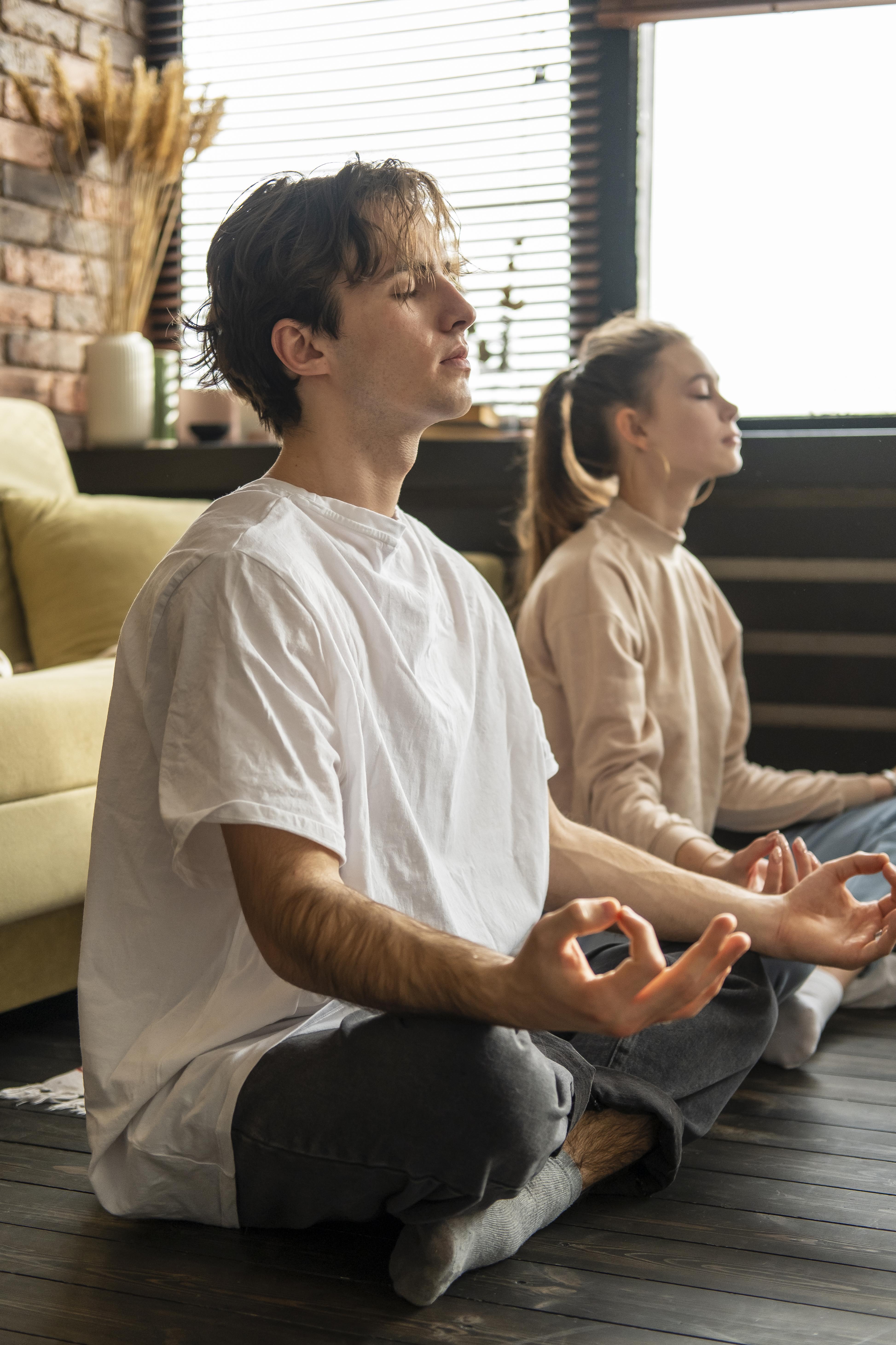 Calm, relaxed portrait of a woman sitting indoors, reflecting before a coaching call